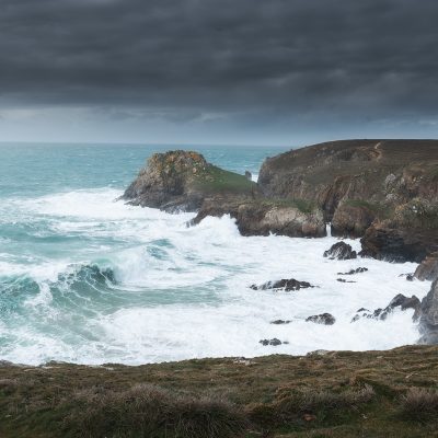 Strong wave hitting the shoreline of Bretagne on a moody afternoon